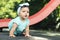 Outdoor portrait of a beautiful baby on all fours.