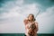 Outdoor portrait of beautiful woman with violin