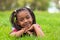 Outdoor portrait of a cute young black girl smiling - African pe