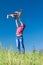 Outdoor portrait of a father who throws daughter in the air against the sky