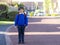 Outdoor portrait of happy child boy with backpack, School kid waiting for school bus, Pupil of primary going to school,Young