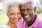 Outdoor Portrait Of Happy Senior Couple