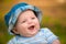 Outdoor portrait of happy smiling infant