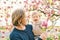 Outdoor portrait of happy young father playing with adorable toddler girl