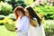 Outdoor portrait of pretty students girls in park after class. Young talented female students dressed in casual clothing