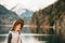 Outdoor portrait of pretty young kid girl visiting Alpsee lake in Bavaria