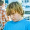 Outdoor portrait of relaxed cute young boy