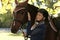 Outdoor portrait of rider and horse