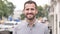 Outdoor portrait of smiling beard casual man