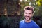 Outdoor Portrait Of Smiling Caucasian Man With Beard At Home  Relaxing At Garden Party