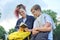 Outdoor portrait of two talking teenagers students