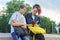 Outdoor portrait of two talking teenagers students