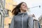 Outdoor portrait of young beautiful smiling woman with shopping bags closeup, spring shopping