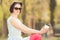 Outdoor portrait of young beautiful woman enjoyng coffee