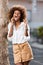 Outdoor portrait of a Young black African American young woman speaking on mobile phone