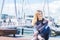 Outdoor portrait of young happy smiling teen girl on marine back