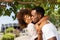 Outdoor protrait of african american couple kissing each other