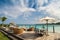 Outdoor restaurant at the beach. Cafe on the beach, ocean and sky. Table setting at tropical beach restaurant. Dominican