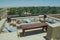 Outdoor restaurant lounge on the roof top with sofas table and comfortable pillows at the desert luxury resort