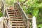 Outdoor rusty steel stairs with wooden handrail