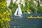 Outdoor sailing and paddling activities on a beautiful mountain lake