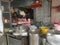 Outdoor scene of a lady preparing take back noodle as the customers waiting at Kg Koh favorite Noodle shop,