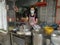 Outdoor scene of a lady preparing take back noodle as the customers waiting at Kg Koh favorite Noodle shop,