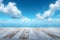 Outdoor serenity wooden floor beneath a tranquil blue sky