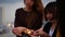 Outdoor shot of young people at rooftop party. Happy group of asia girl friends enjoy and play sparkler at roof top party.