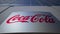 Outdoor signage board with Coca-Cola logo. Modern office building. Editorial 3D rendering