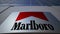 Outdoor signage board with Marlboro logo. Modern office building. Editorial 3D rendering