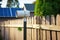 outdoor, solar-powered, wireless security camera on fence