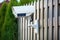 outdoor, solar-powered, wireless security camera on fence