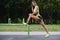 Outdoor sport Beautiful strong athletic muscular young caucasian fitness woman workout training in the gym on diet pumping up