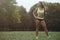 Outdoor sport Beautiful strong athletic muscular young caucasian fitness woman workout training in the gym on diet pumping up