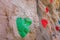 Outdoor sports climbing stone wall with multiple grips simulating mountain climbing, extreme hobby concept