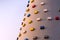 Outdoor sports climbing stone wall with multiple grips simulating mountain climbing, extreme hobby concept