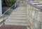 Outdoor stone staircase. Stone steps of old staircase with stainless steel.