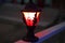 Outdoor Street lamp with light fixture in the dark. The lantern shines in the street in the dark.