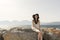 Outdoor summer portrait of young pretty woman looking to the camera in the port of Agios Nikolaos, enjoy her freedom and fresh air