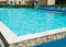 Outdoor swimming pool in the recreation area on the territory of a luxury hotel in the resort, the concept of summer idyllic