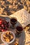 Outdoor table arrangement with glasses of wine, dried fruits and