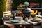 outdoor table with ceramic dishes and food next to barbecue backyard grill