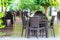 Outdoor tables and chairs, empty beach restaurant table. Rattan style furniture in the restaurant