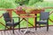 Outdoor terrace cafe table with two chairs