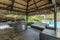 Outdoor tiki hut with outdoor grill kitchen and pool