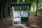 Outdoor toilet with two seats in a forest