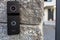 Outdoor video intercom system with speaker mounted on the stone wall