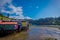 Outdoor view of beautiful coorful wooden houses on stilts palafitos, in a low tide day view in gorgeous sunny day in