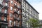 Outdoor view of a block of historic buildings on Orchard Street in the Lower East Side neighborhood of Manhattan in New York City